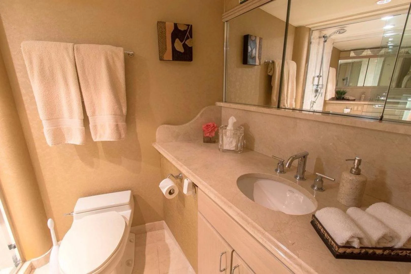 a bathroom with a sink and towels aboard MONARCH Yacht for Sale