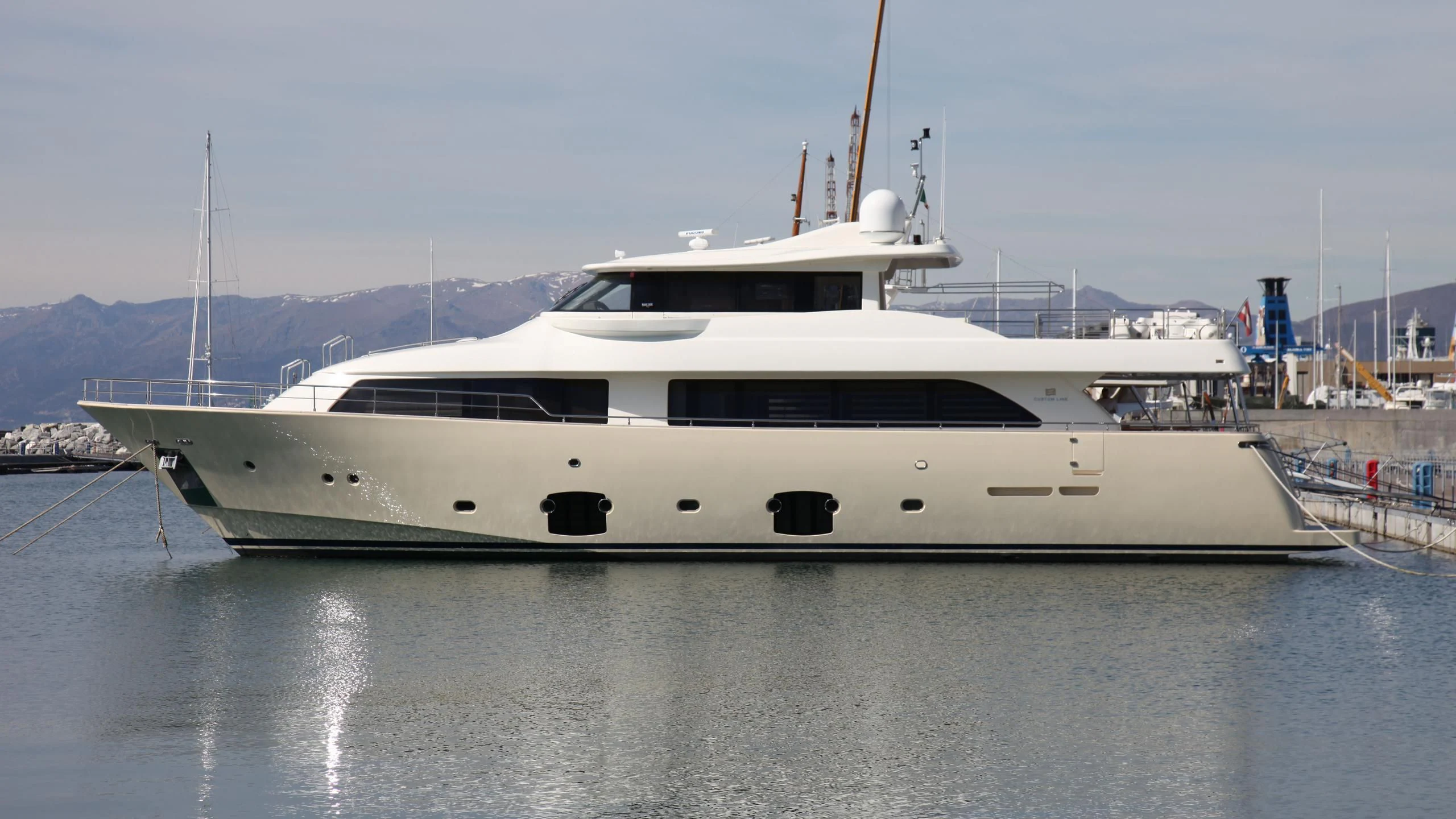 a white yacht docked aboard ULYSSIA Yacht for Sale