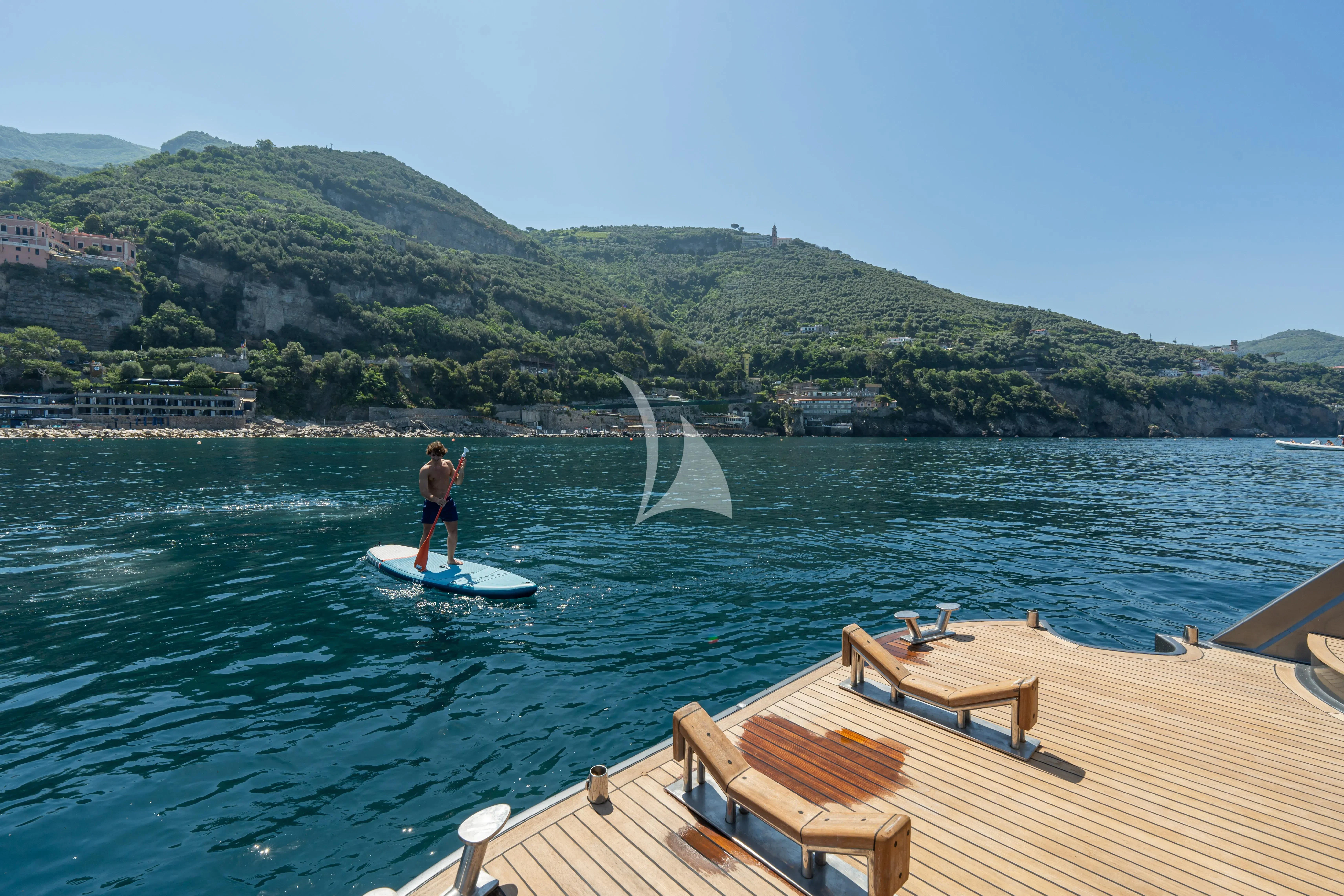 a person surfing on the sea aboard LADY B Yacht for Charter