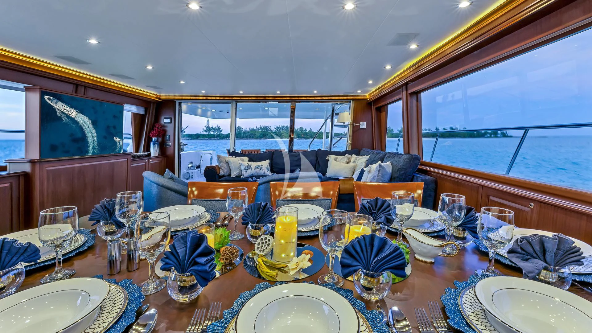 a dining room with a large table set for a meal aboard LADY B Yacht for Charter