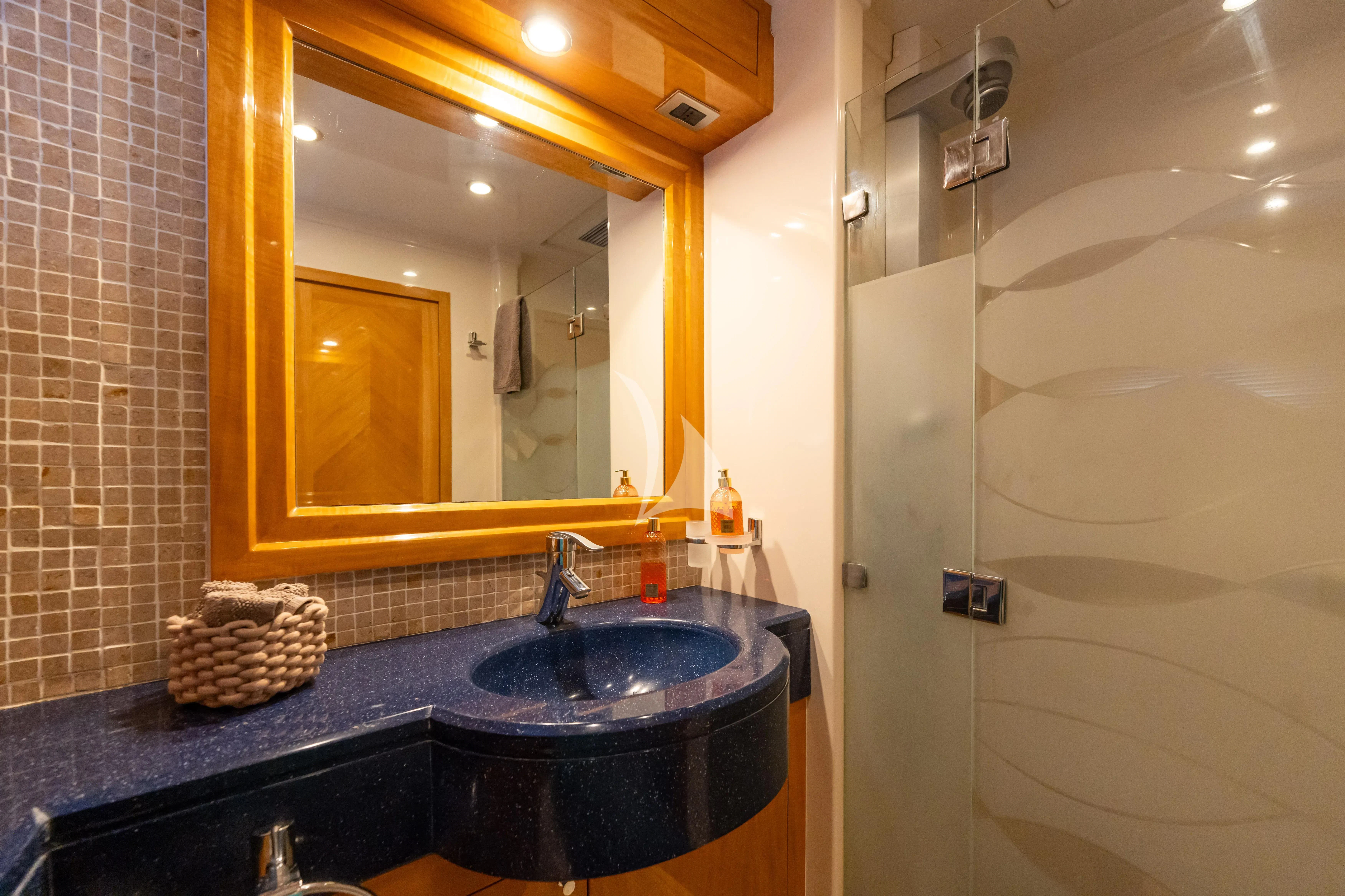 a bathroom with a large mirror aboard LADY B Yacht for Charter