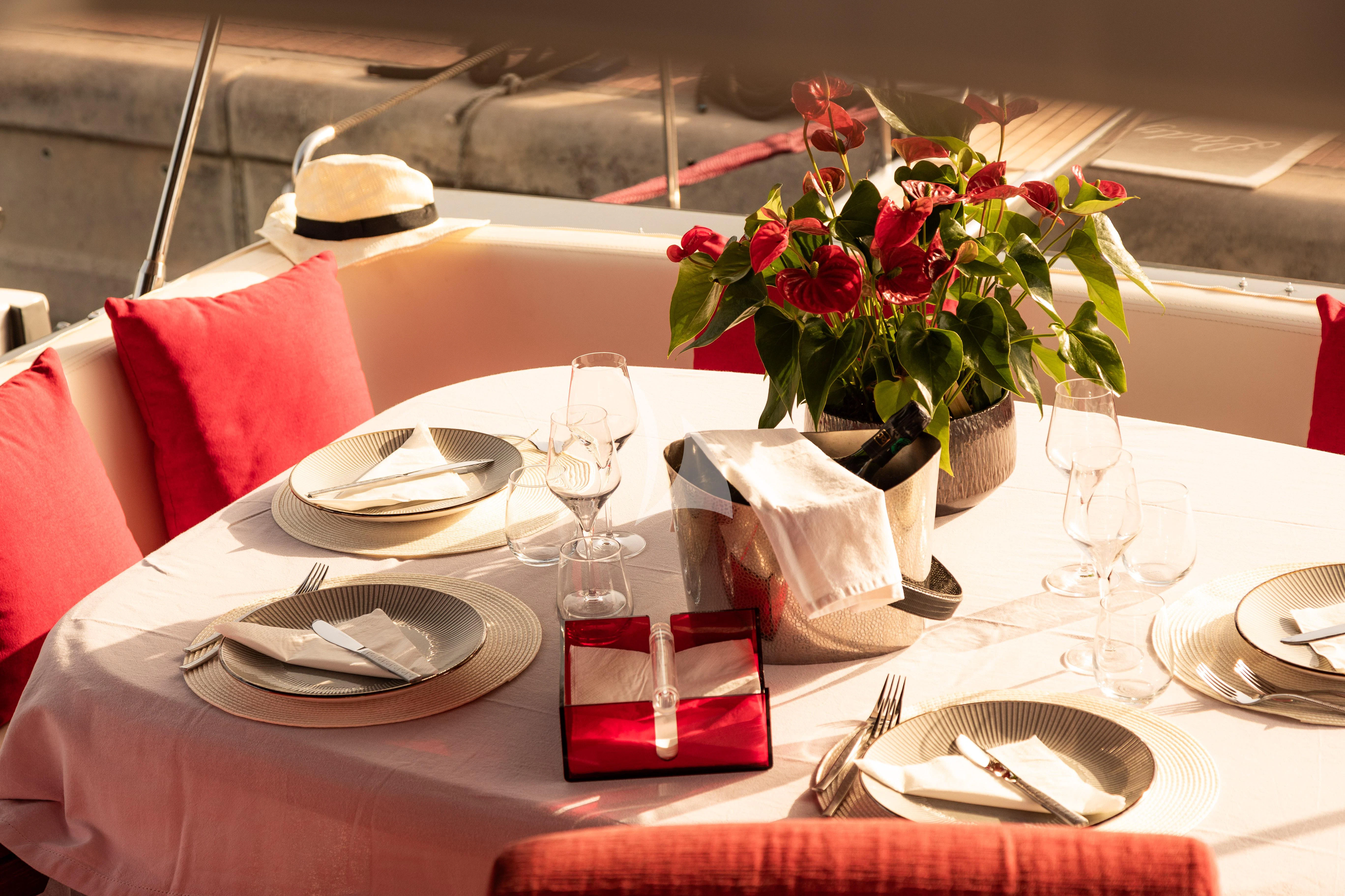 a table with place settings aboard LADY B Yacht for Charter