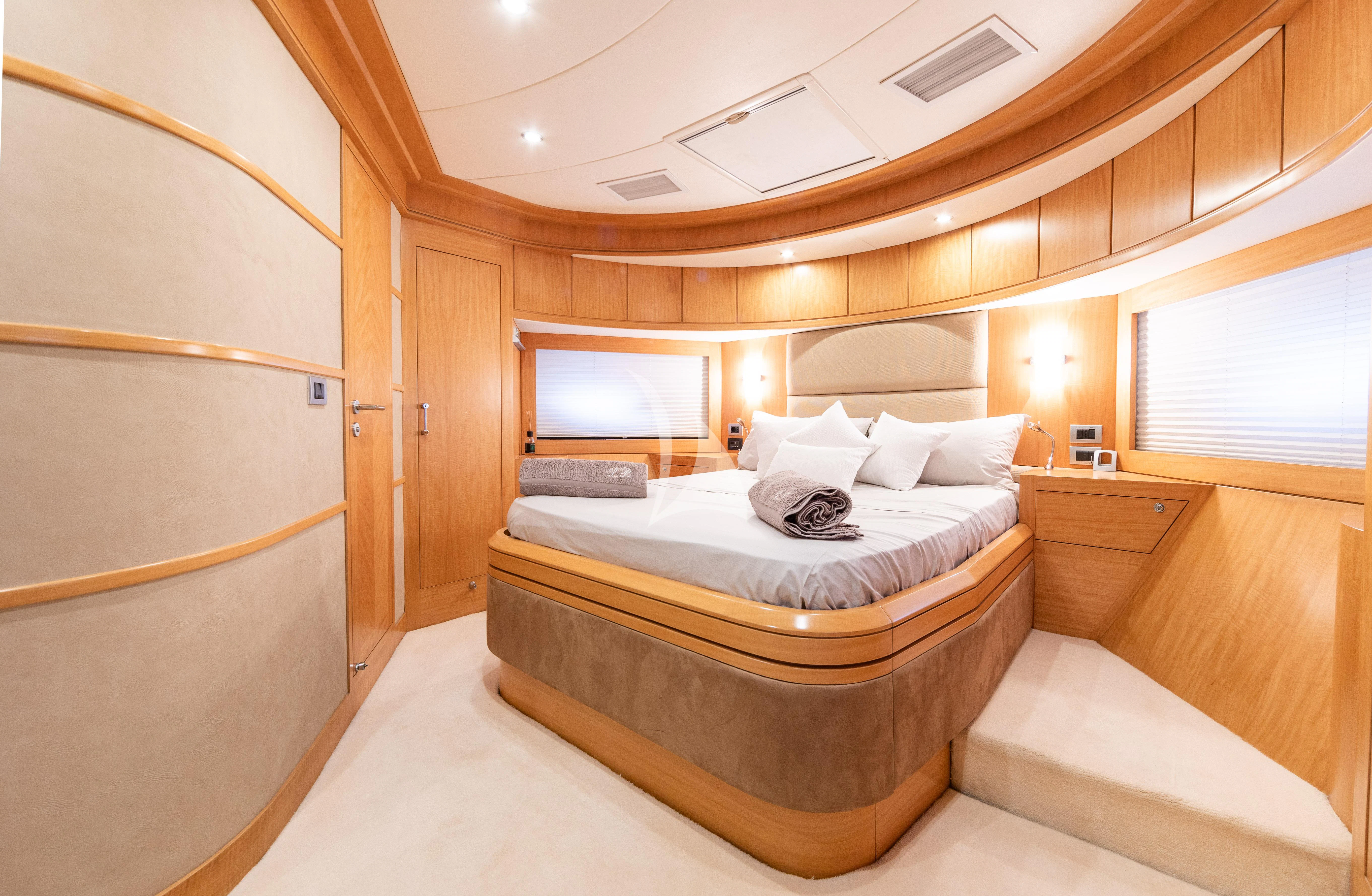 a large bedroom with a large bed aboard LADY B Yacht for Charter