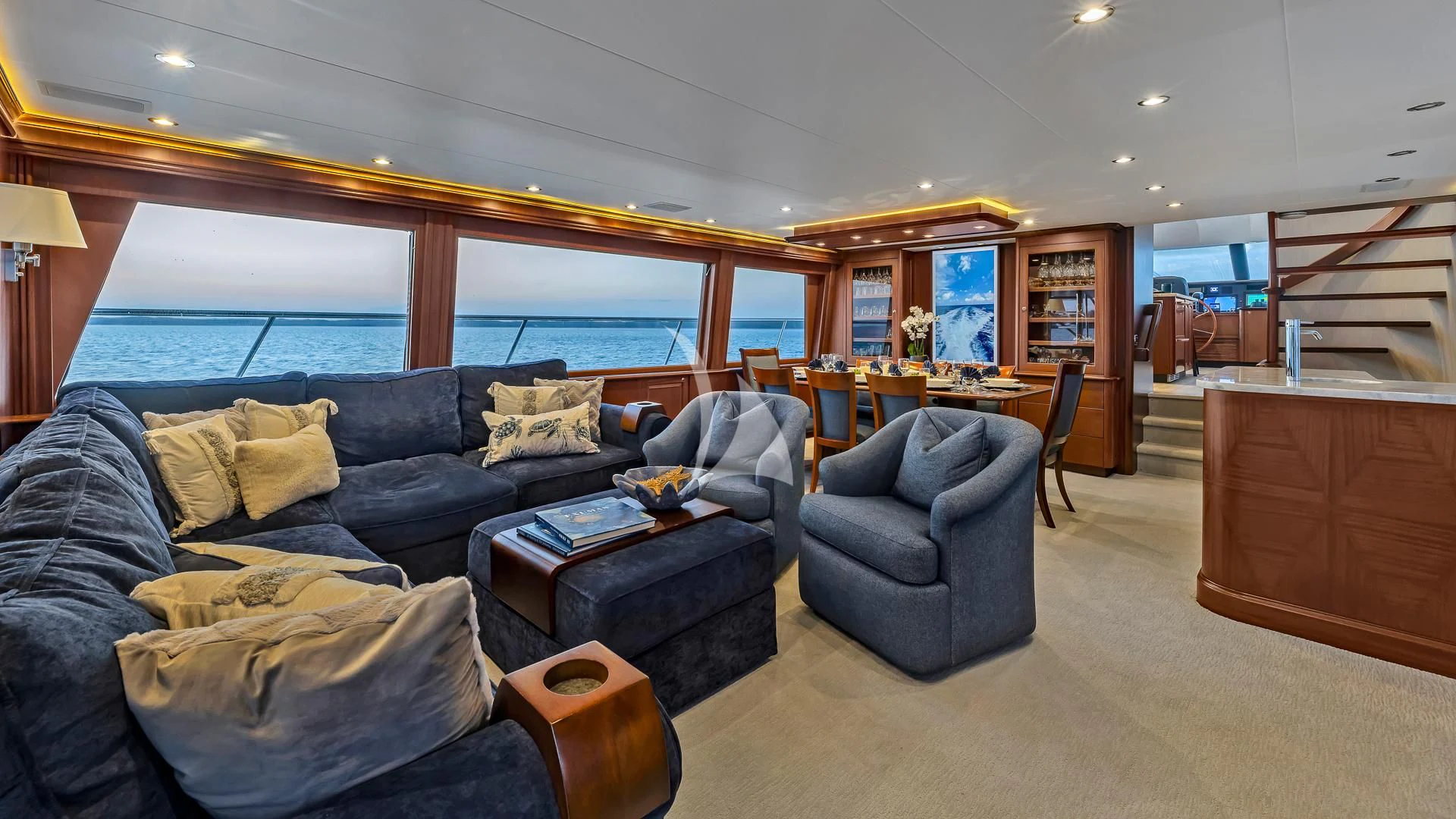 a living room with a large window aboard LADY B Yacht for Charter