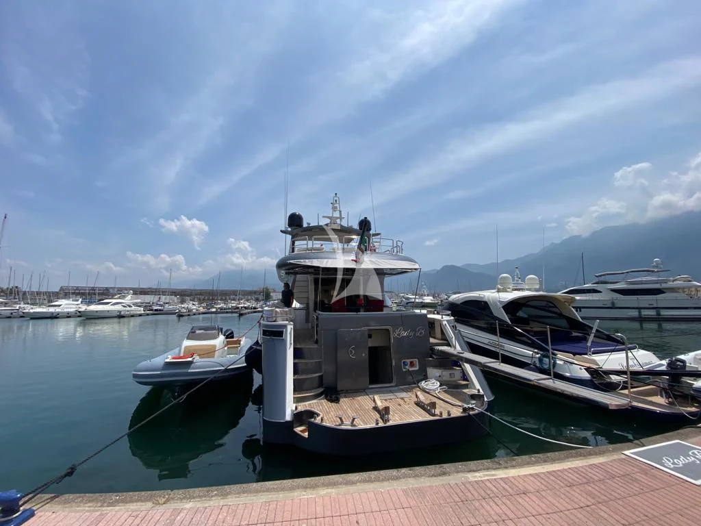 a boat docked at a pier aboard LADY B Yacht for Charter