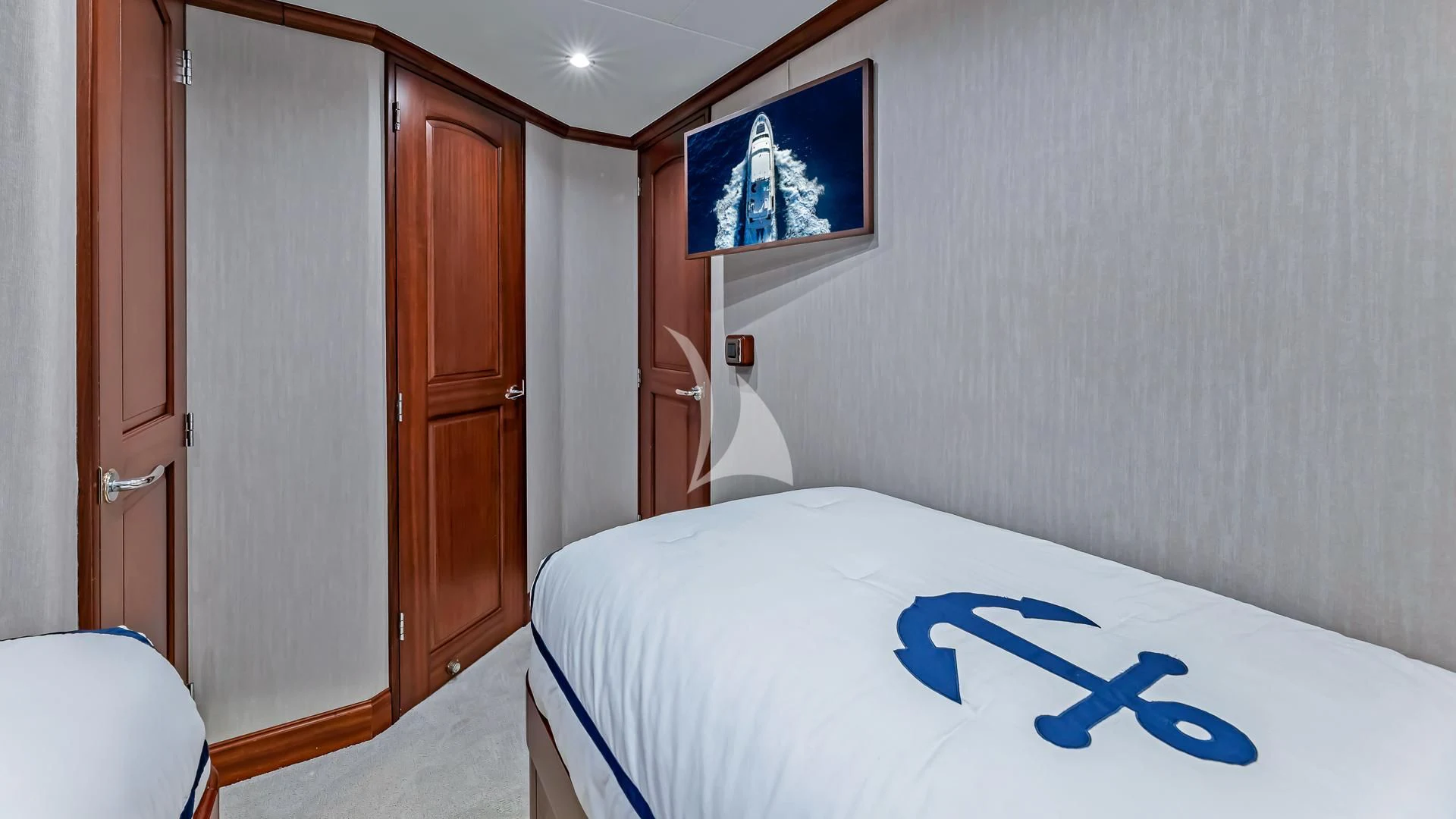 a bedroom with a bed and a closet aboard LADY B Yacht for Charter