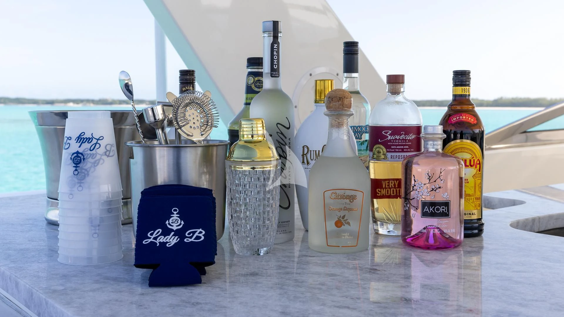 a group of bottles and cans on a table aboard LADY B Yacht for Charter