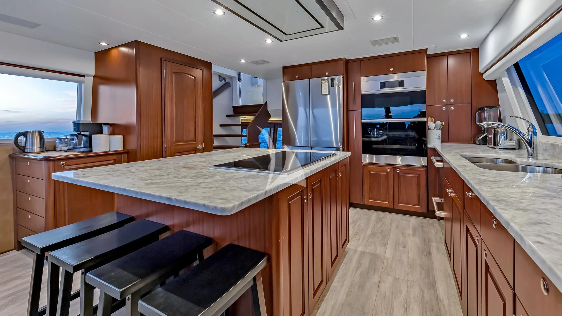 a kitchen with wooden cabinets aboard LADY B Yacht for Charter