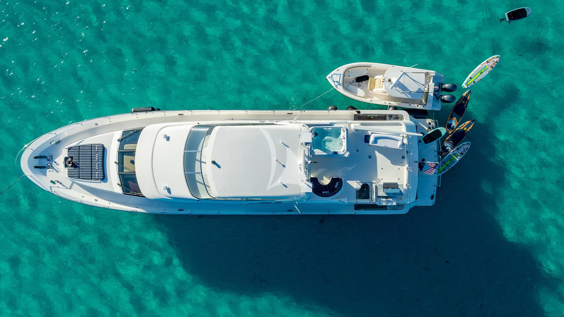 a helicopter flying over a body of water aboard LADY B Yacht for Charter