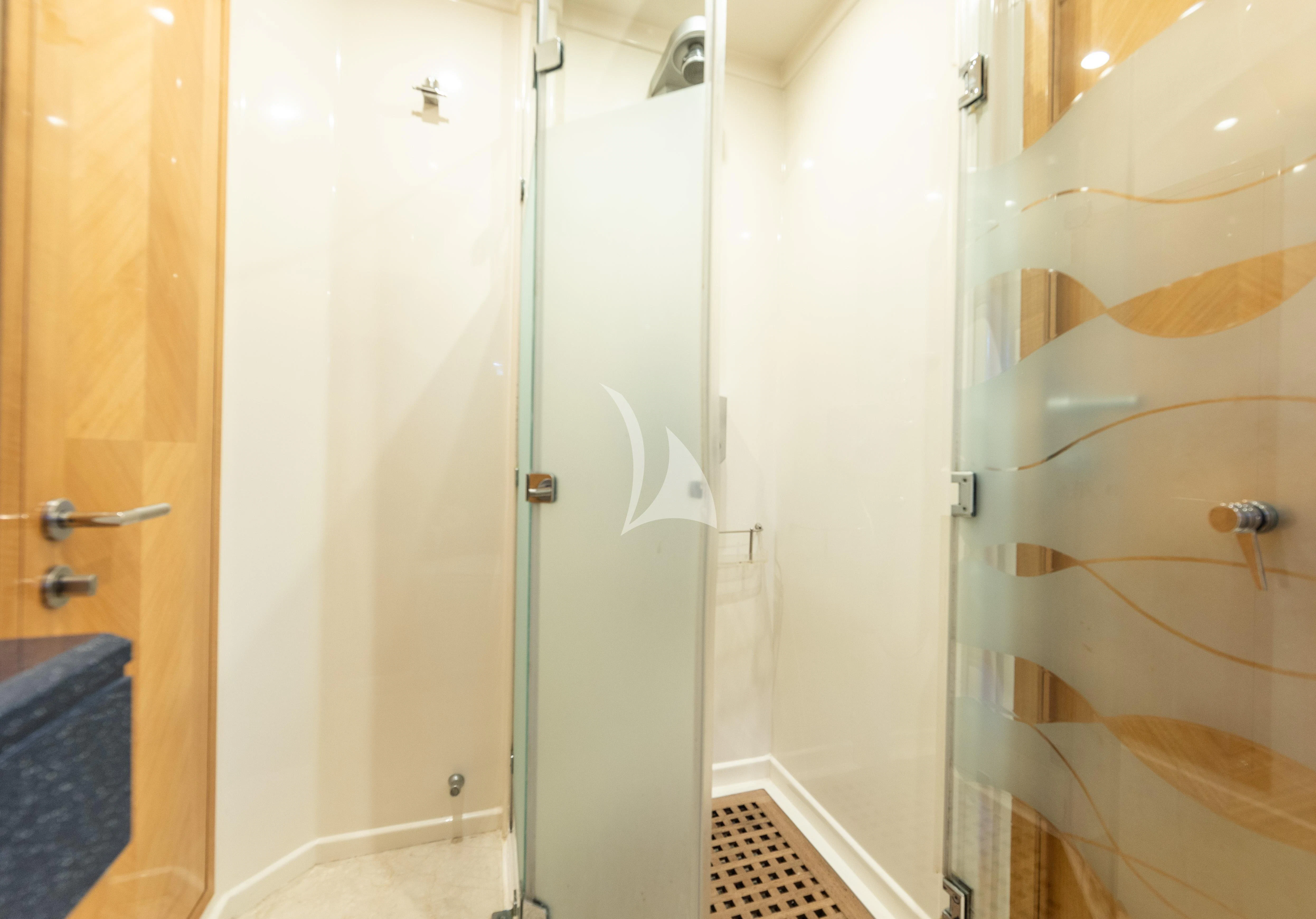 a bathroom with a glass shower aboard LADY B Yacht for Charter