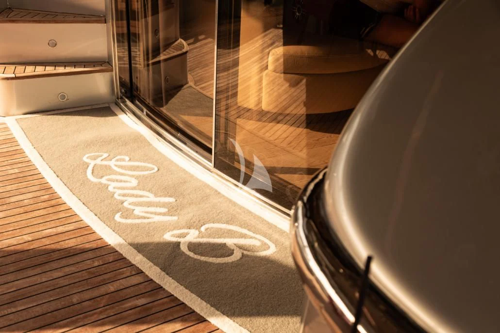 a guitar on a rug aboard LADY B Yacht for Charter
