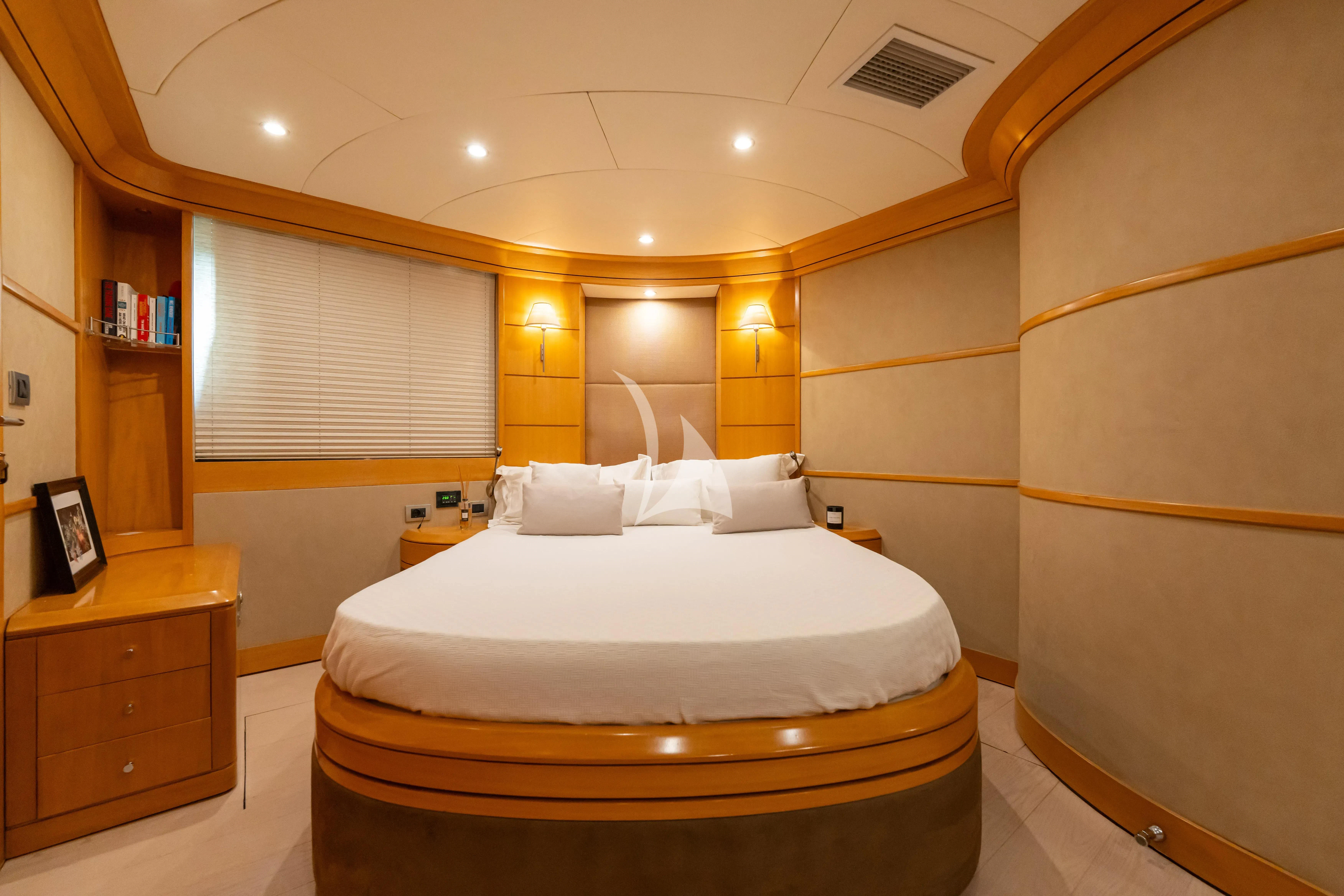 a large bedroom with a large bed aboard LADY B Yacht for Charter