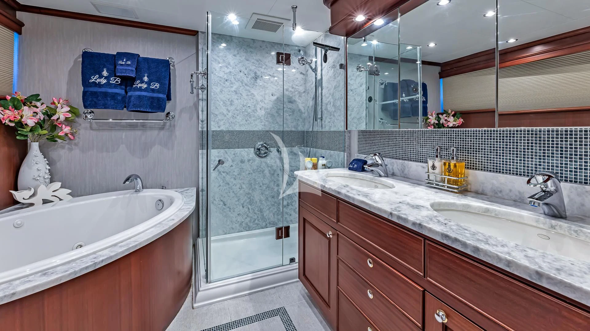 a bathroom with a glass shower aboard LADY B Yacht for Charter