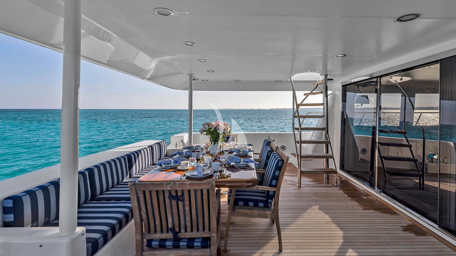 a table and chairs on a boat aboard LADY B Yacht for Charter