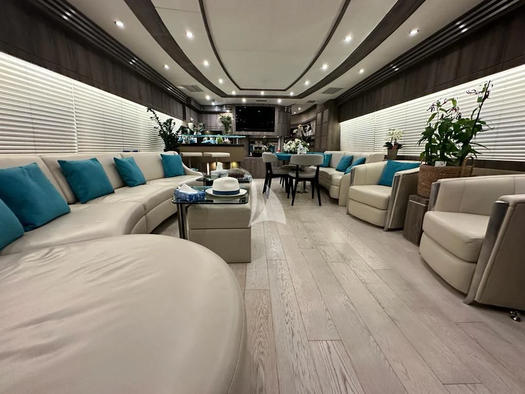 a room with a bed and a couch aboard LADY B Yacht for Charter