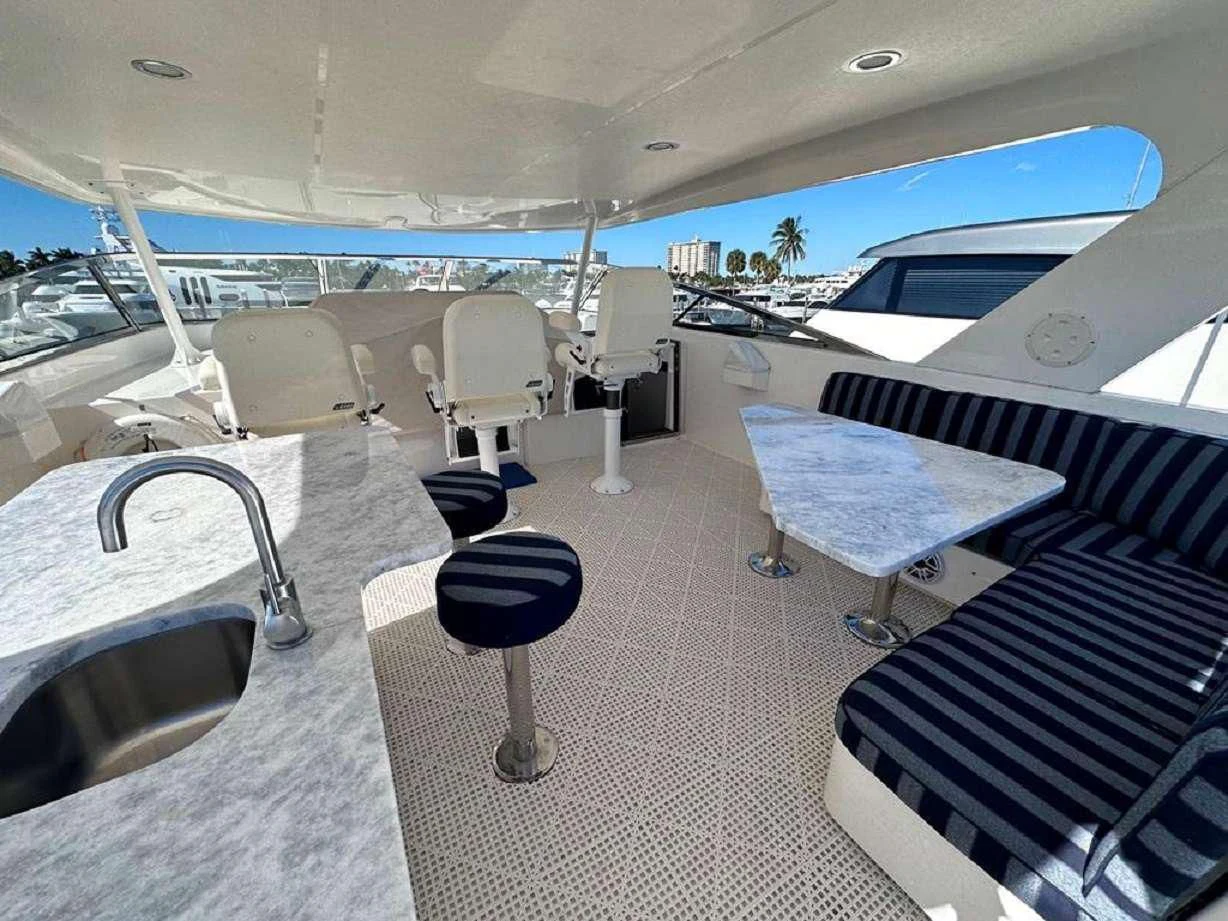 a room with chairs and tables aboard LADY B Yacht for Charter