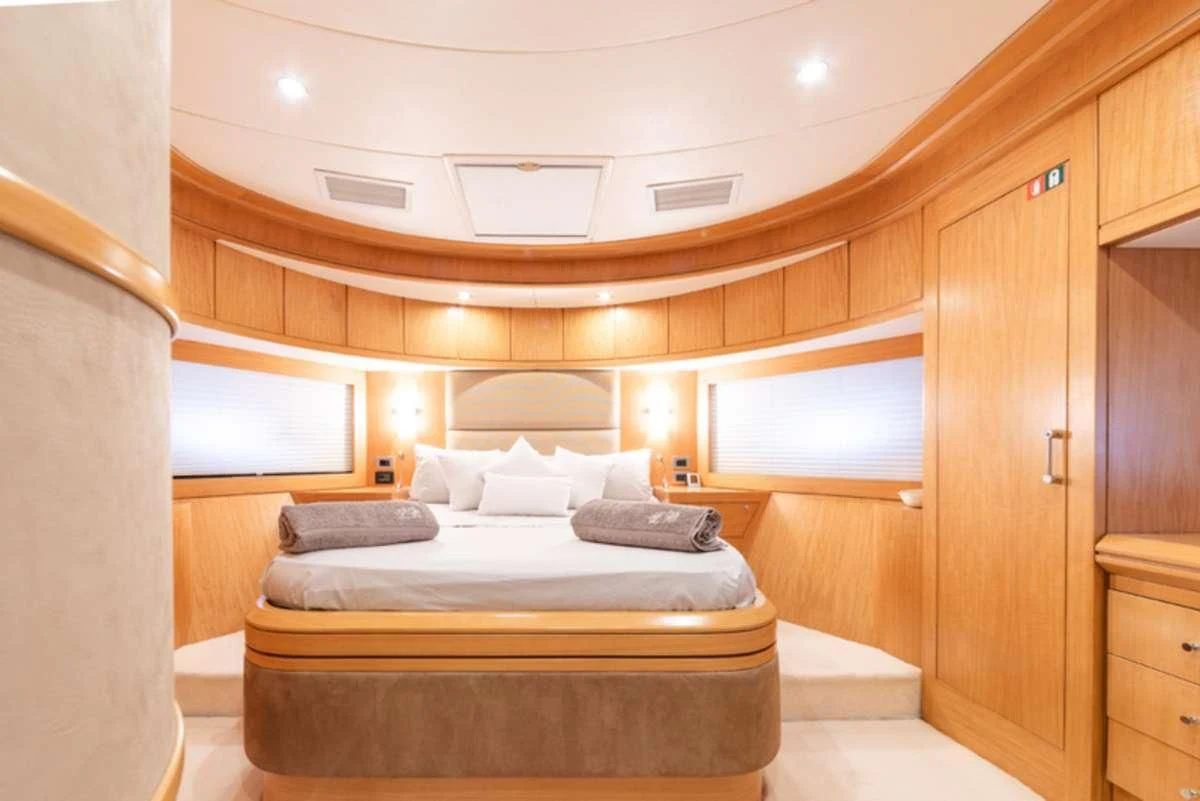 a bed in a room aboard LADY B Yacht for Charter