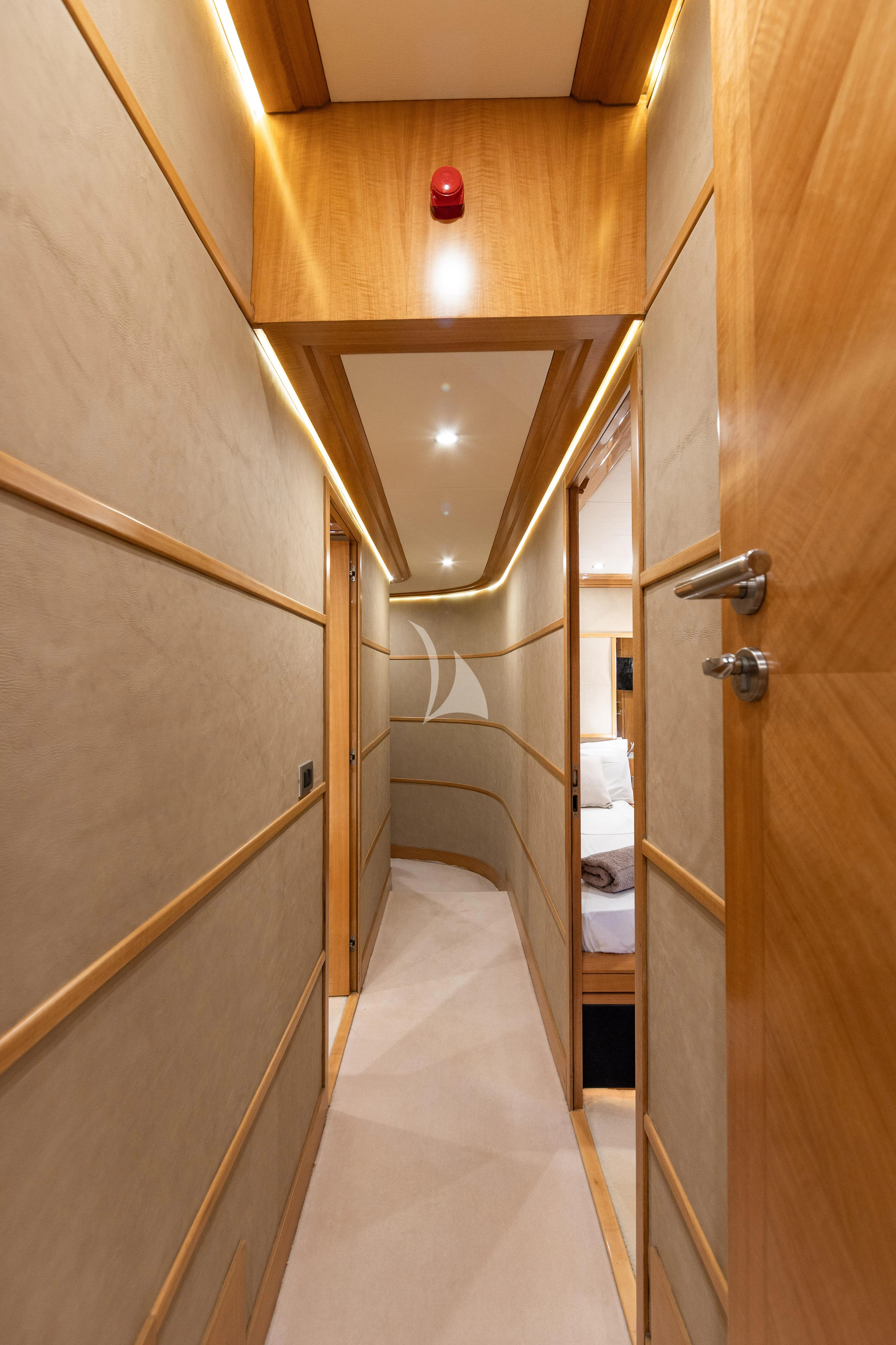 a bathroom with a wood wall aboard LADY B Yacht for Charter
