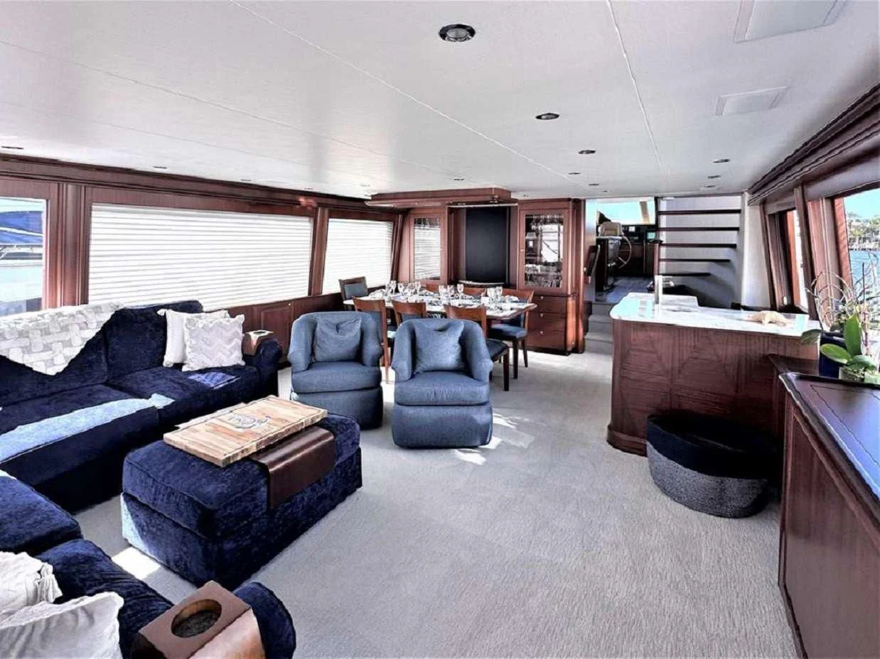 a living room with a couch and a table aboard LADY B Yacht for Charter