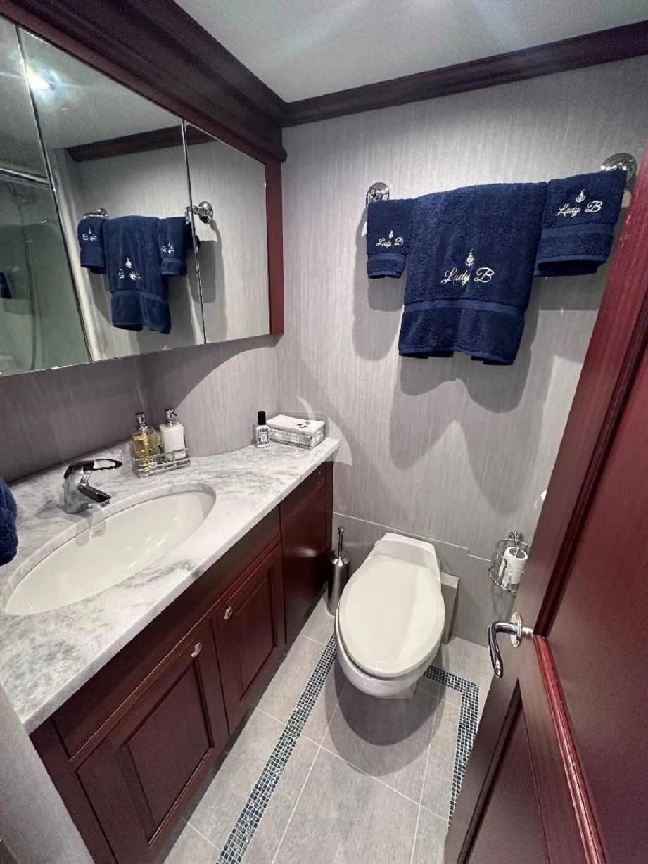 a bathroom with a toilet and sink aboard LADY B Yacht for Charter