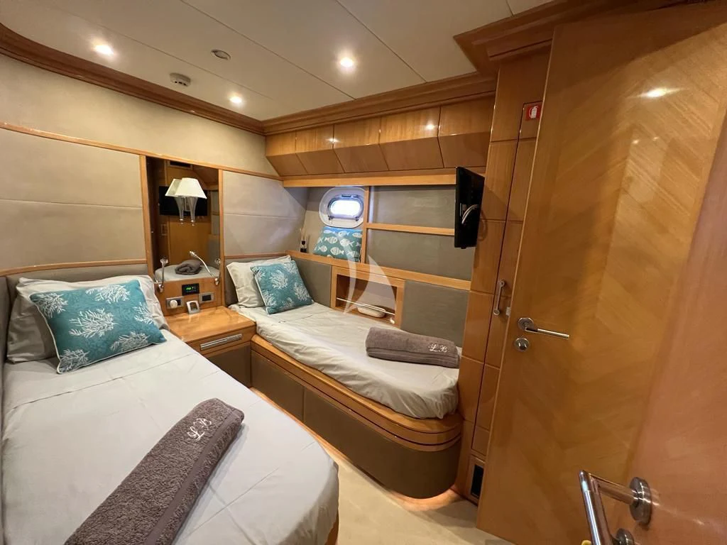 a room with a bed and a closet aboard LADY B Yacht for Charter