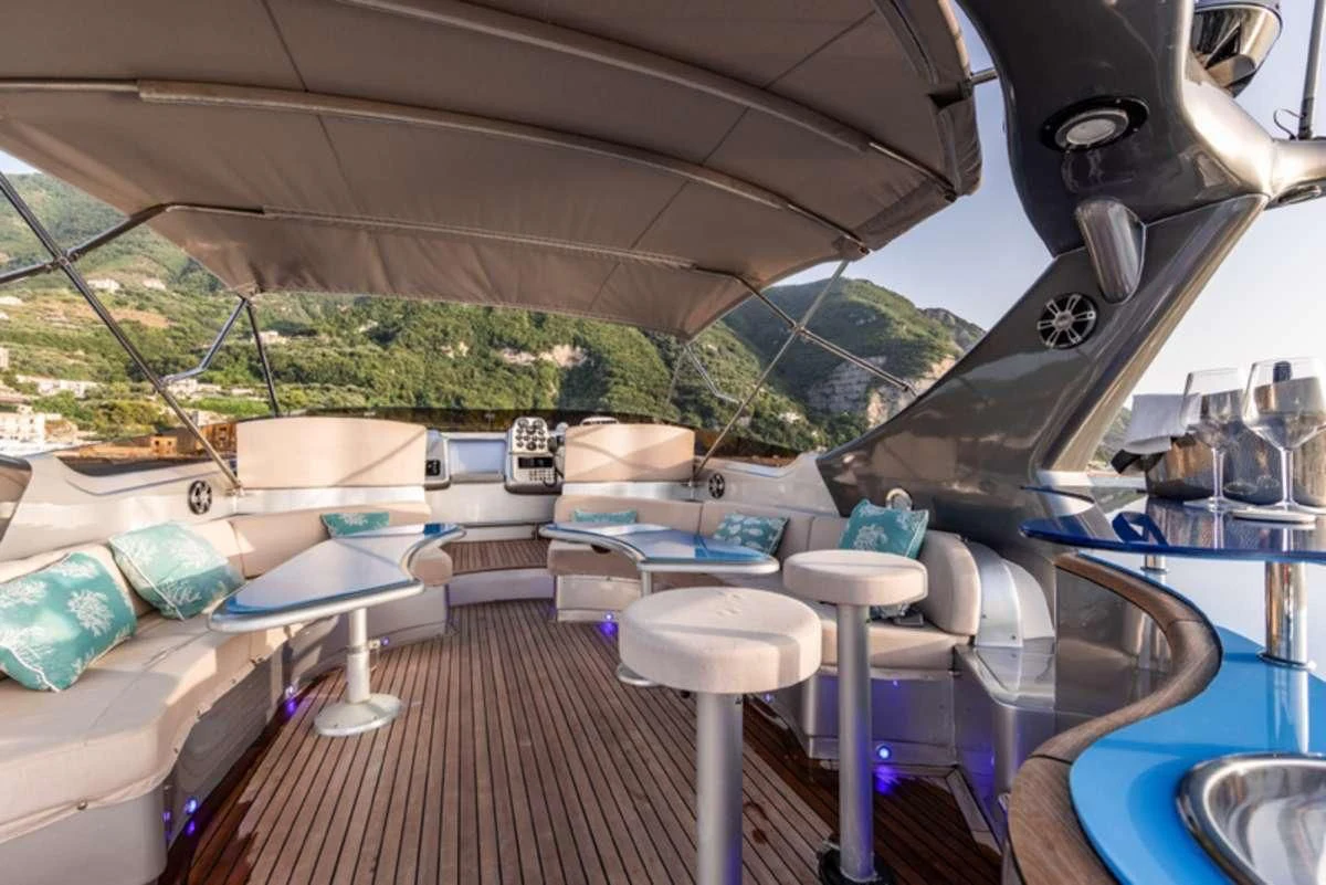 a boat with a deck and chairs aboard LADY B Yacht for Charter