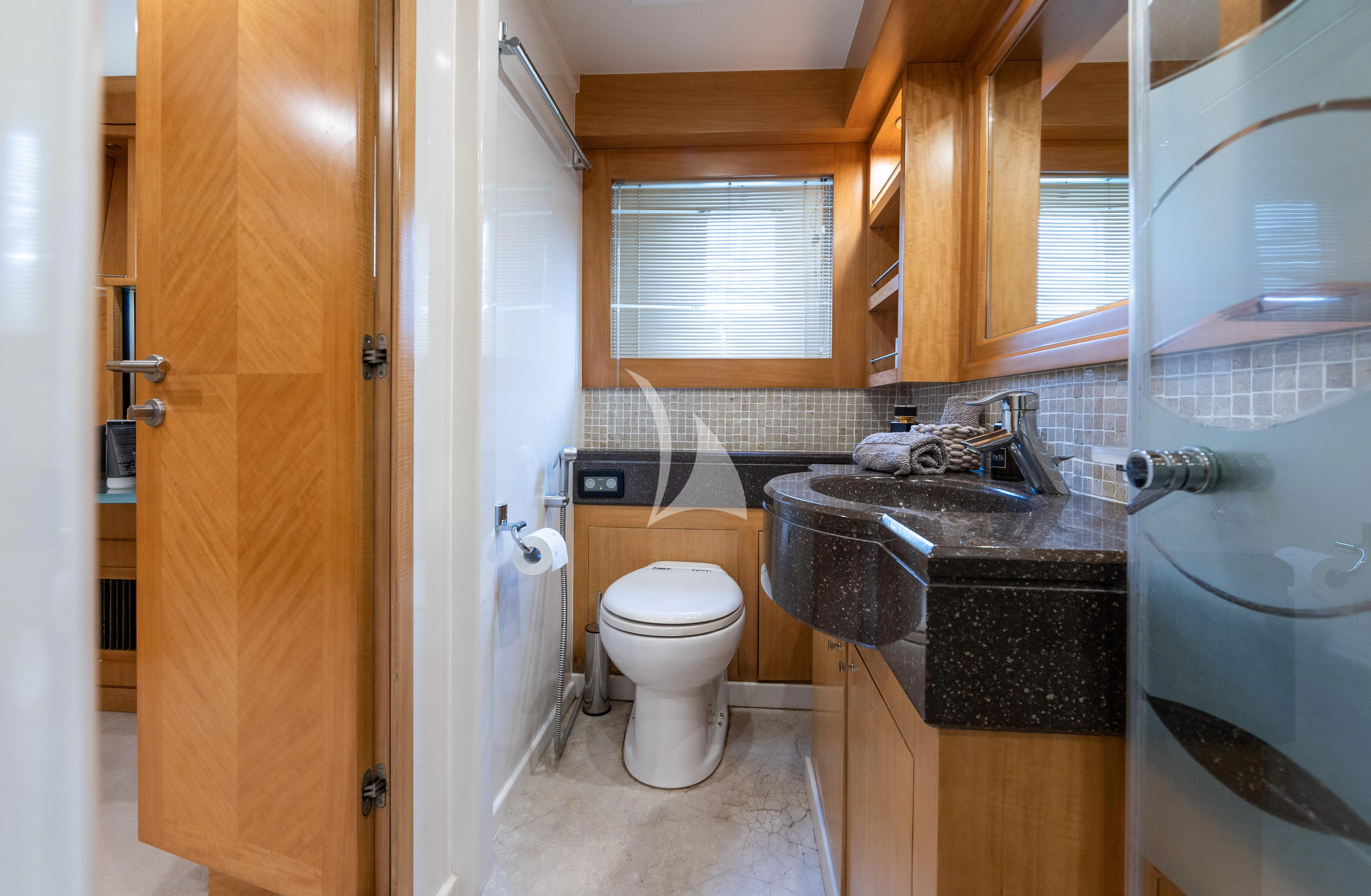 a bathroom with a sink toilet and a shower aboard LADY B Yacht for Charter