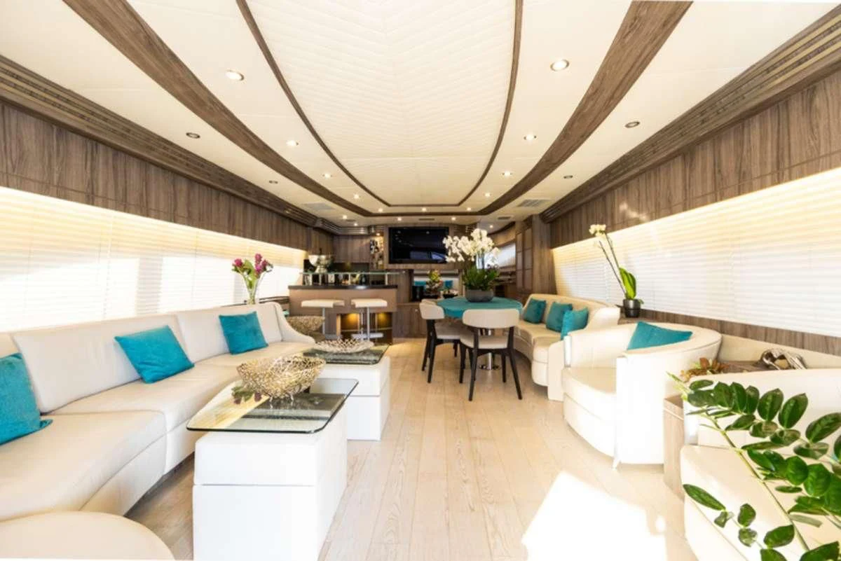 a room with a couch and a table and chairs aboard LADY B Yacht for Charter