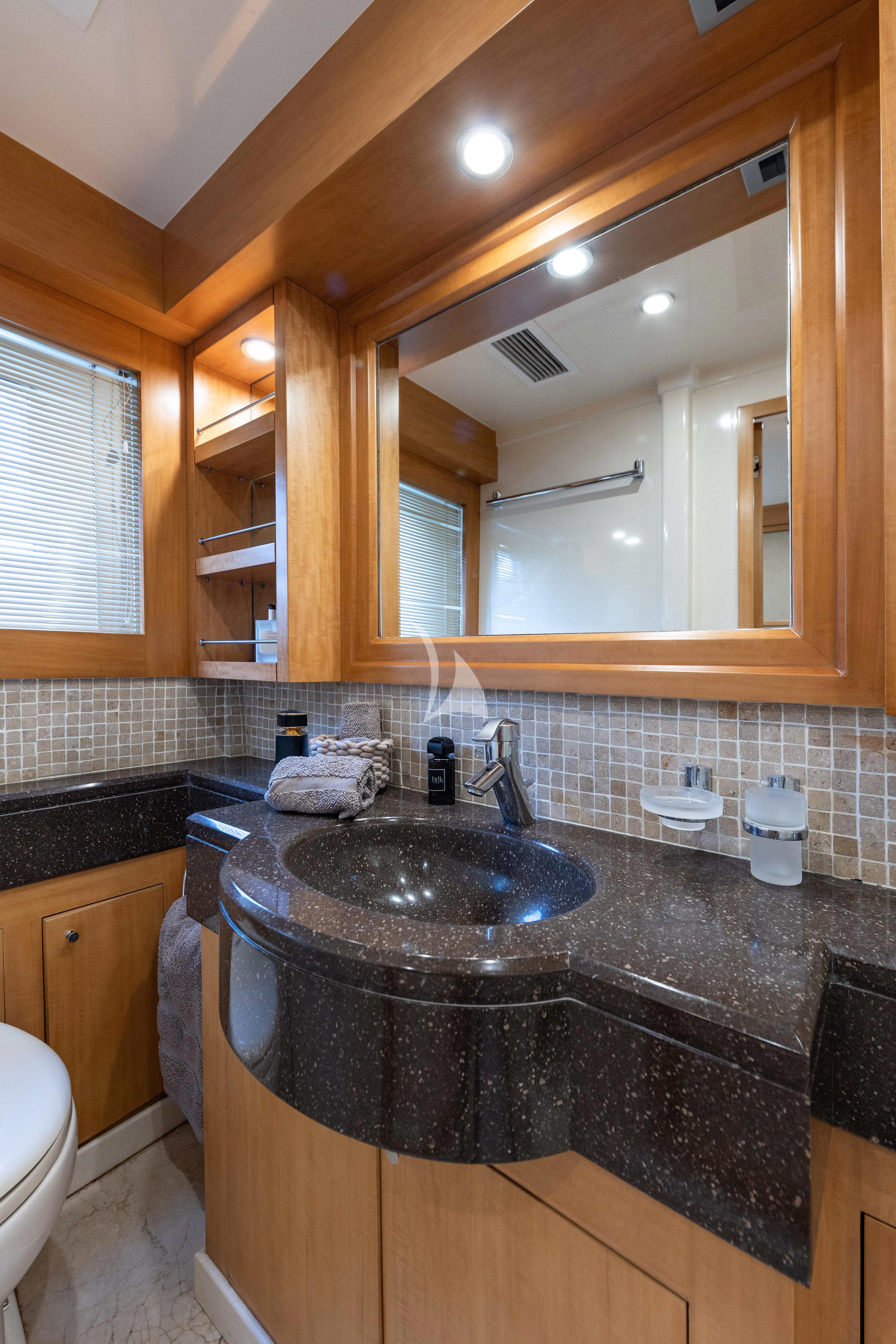 a bathroom with a large mirror aboard LADY B Yacht for Charter