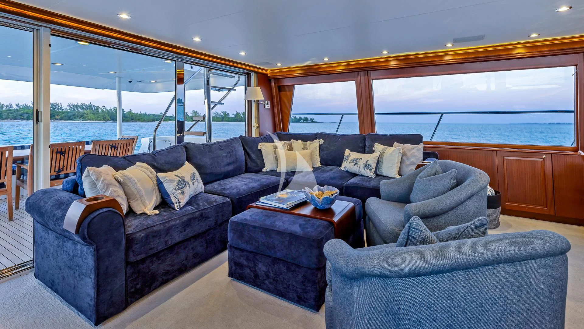 a living room with a large window aboard LADY B Yacht for Charter