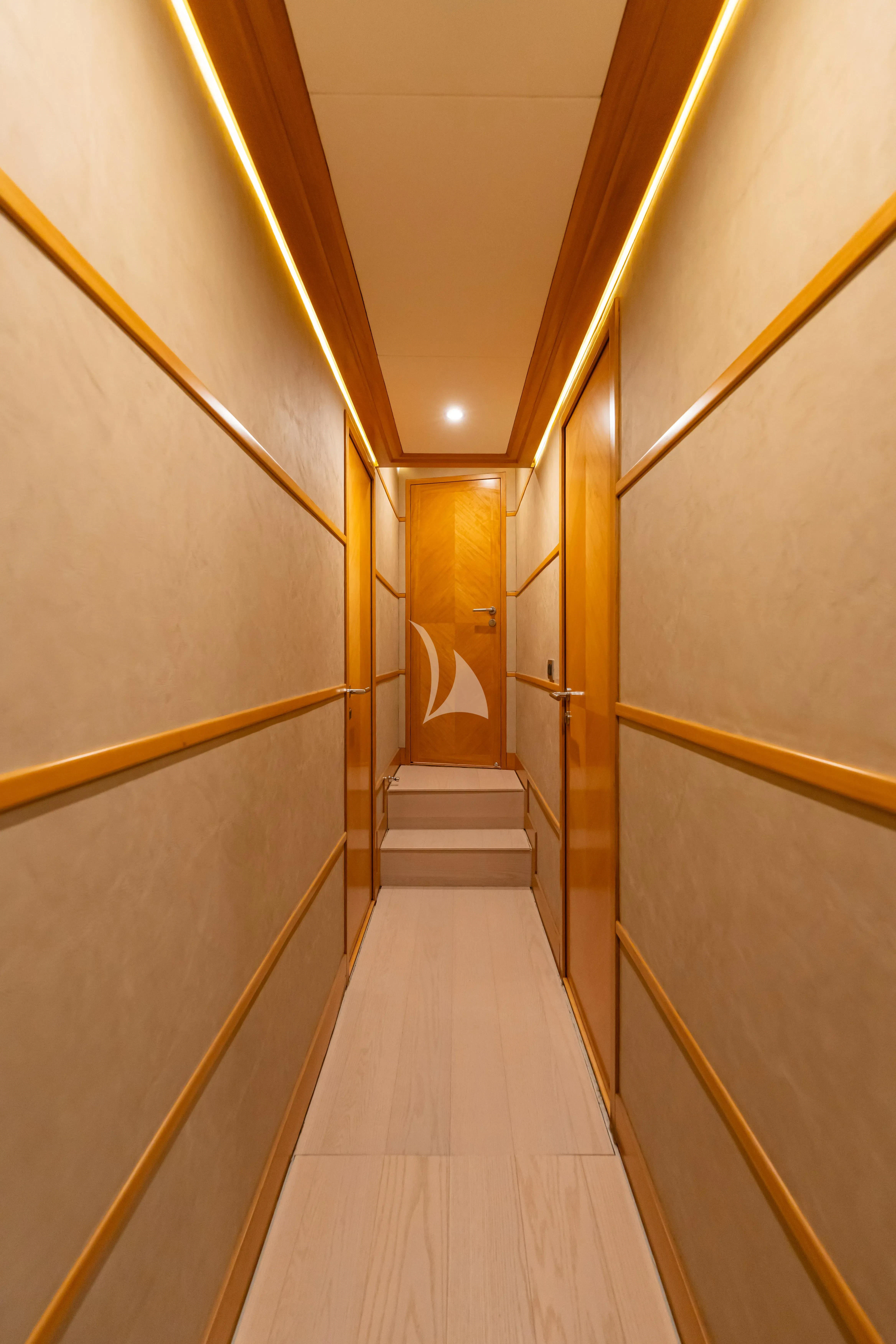 a hallway with a white dress aboard LADY B Yacht for Charter