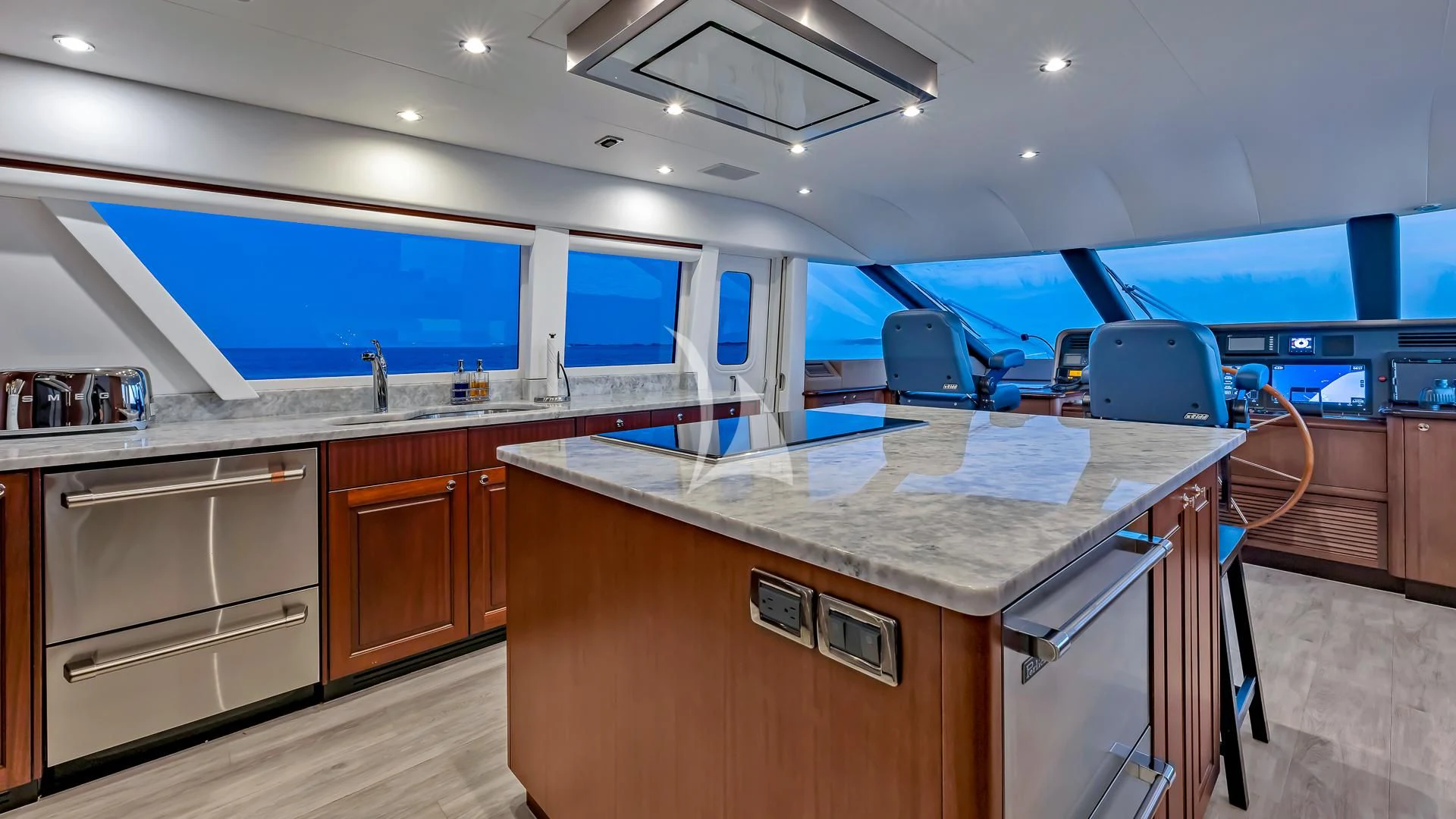 a kitchen with a large island aboard LADY B Yacht for Charter