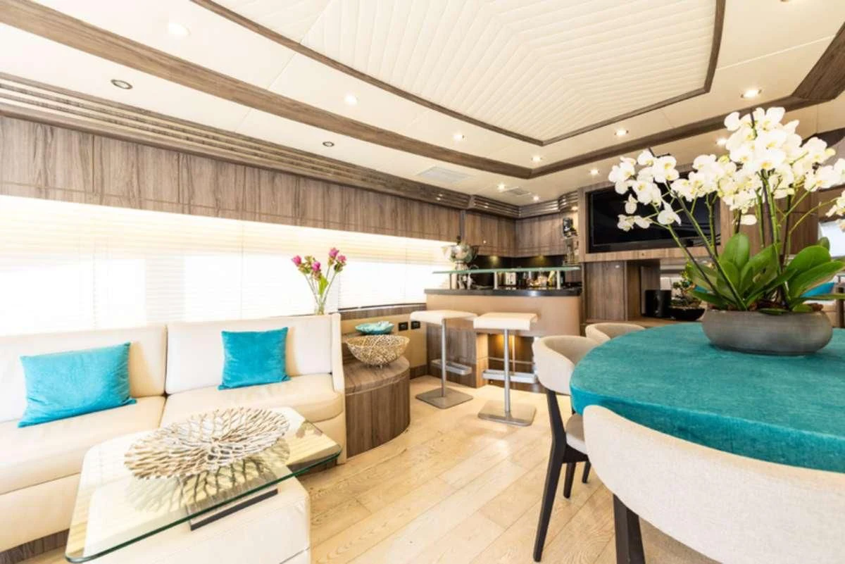 a room with a table and chairs aboard LADY B Yacht for Charter