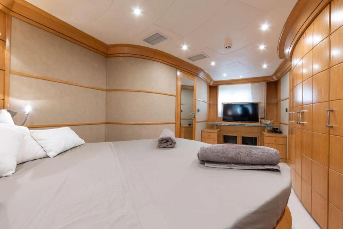 a bed in a room aboard LADY B Yacht for Charter