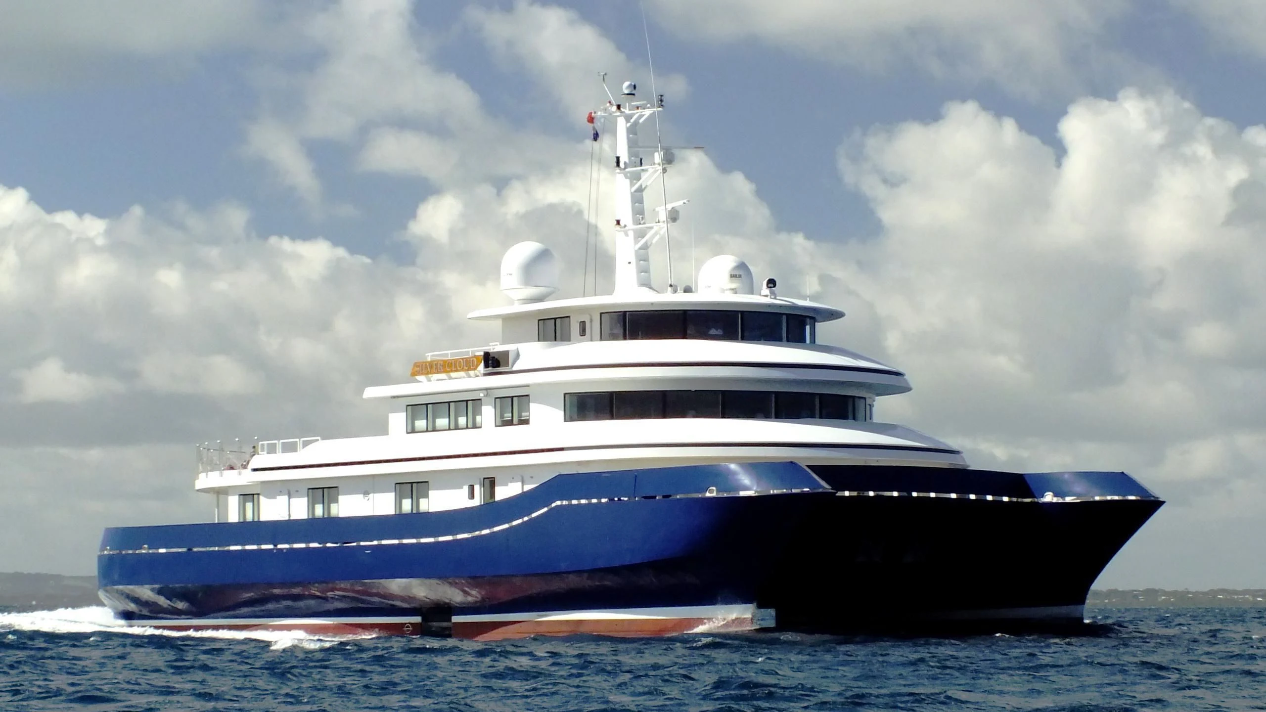 a large blue and white boat aboard NURJA Yacht for Sale