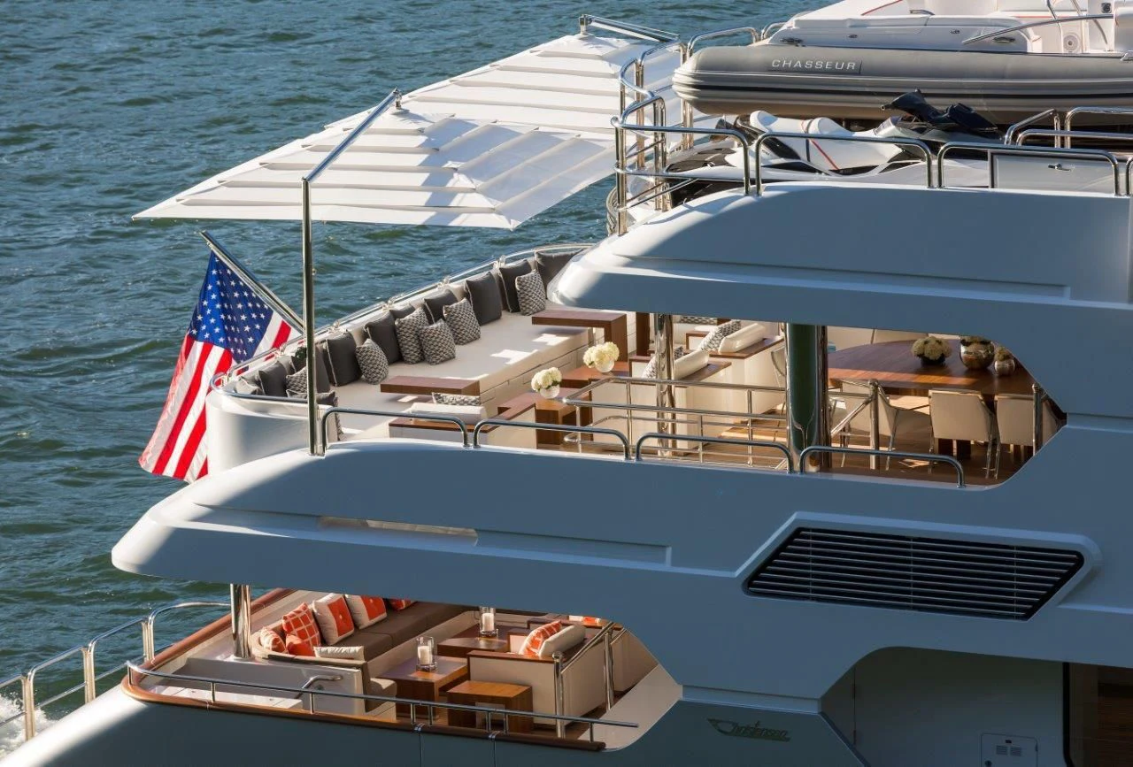 a boat with a flag on the front aboard CHASSEUR Yacht for Charter