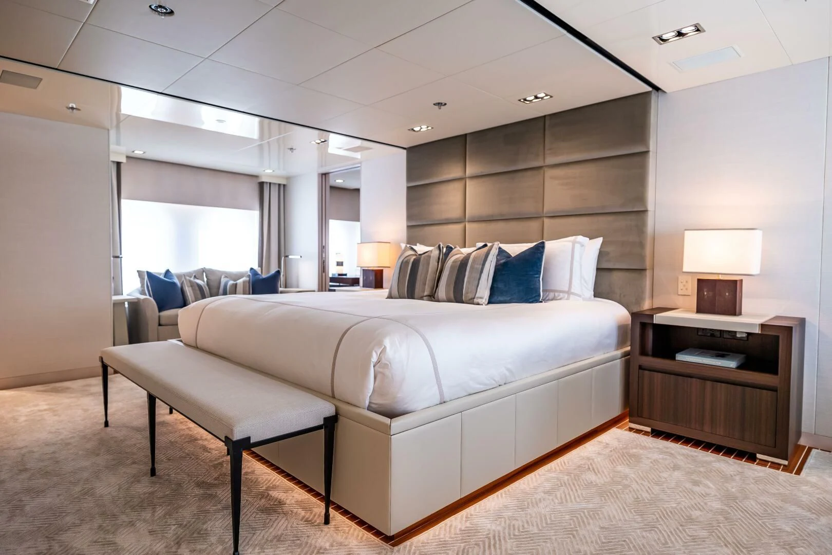 a large white bed in a room aboard CHASSEUR Yacht for Charter