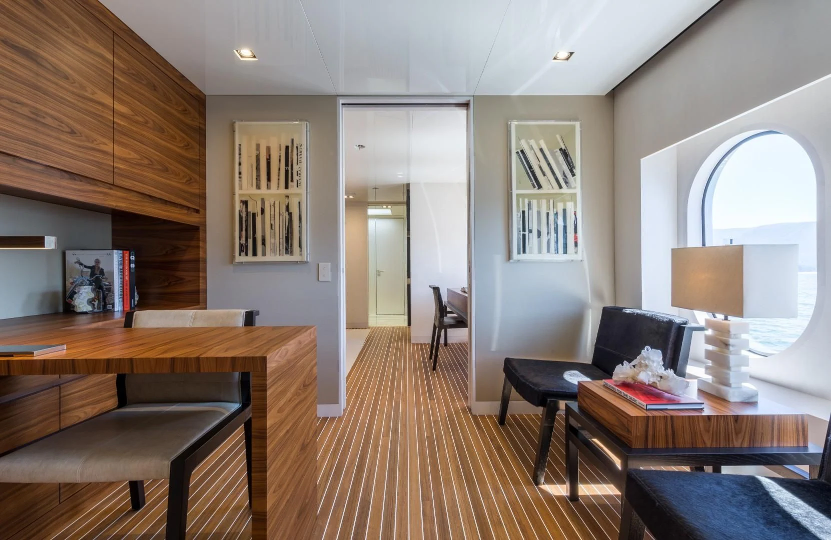a living room with a wood floor aboard CHASSEUR Yacht for Charter