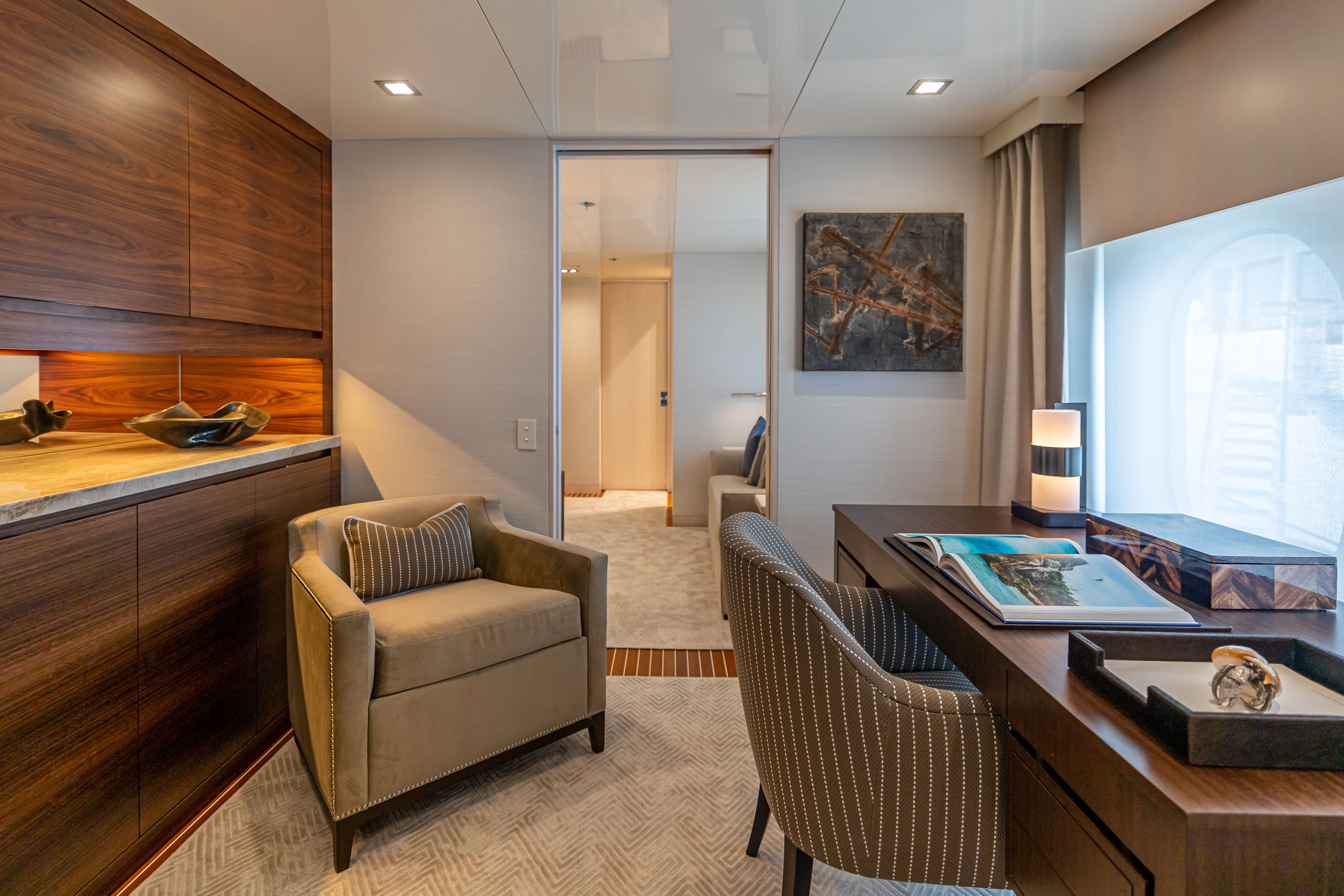 a living room with a couch and a table aboard CHASSEUR Yacht for Charter