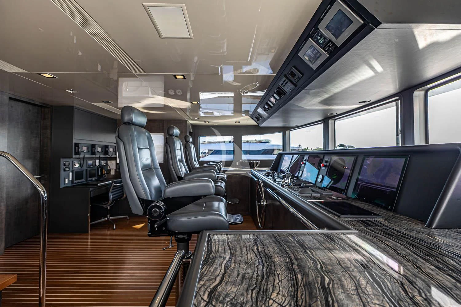 inside of a vehicle with many screens aboard CHASSEUR Yacht for Charter