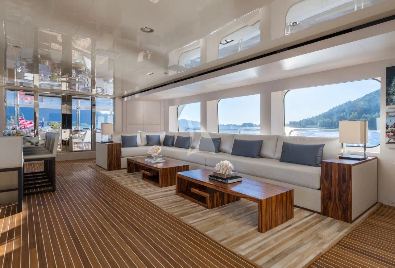 a living room with a large window aboard CHASSEUR Yacht for Charter