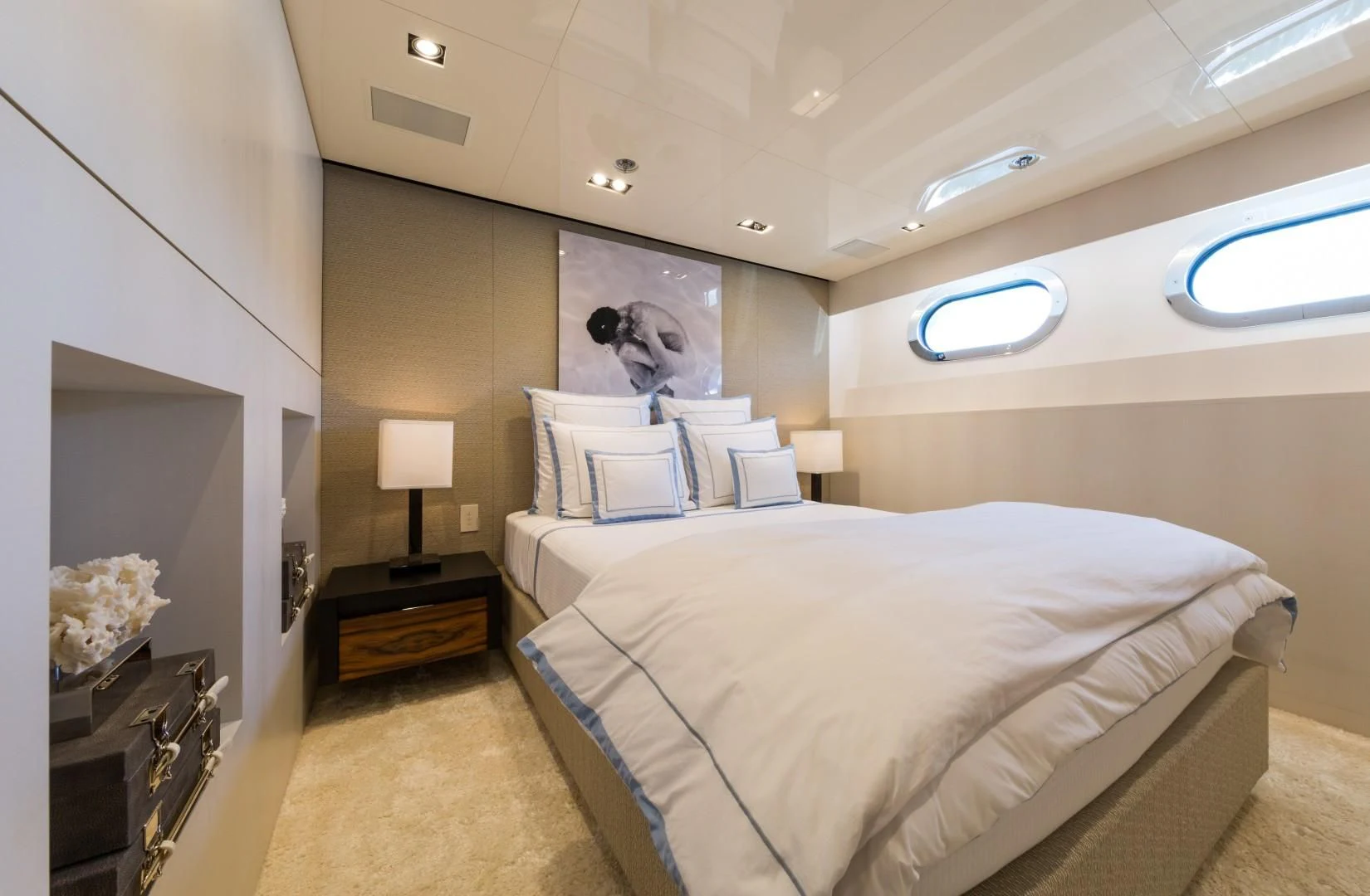 a bedroom with two beds aboard CHASSEUR Yacht for Charter