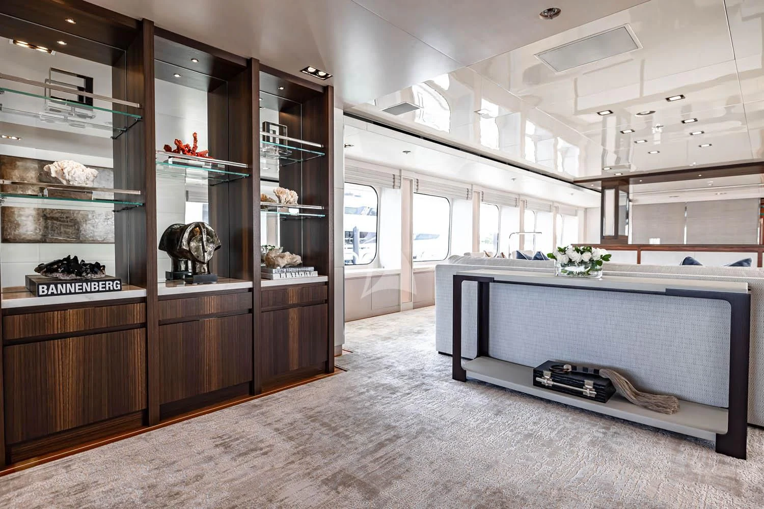 a room with a large shelf and a tv aboard CHASSEUR Yacht for Charter