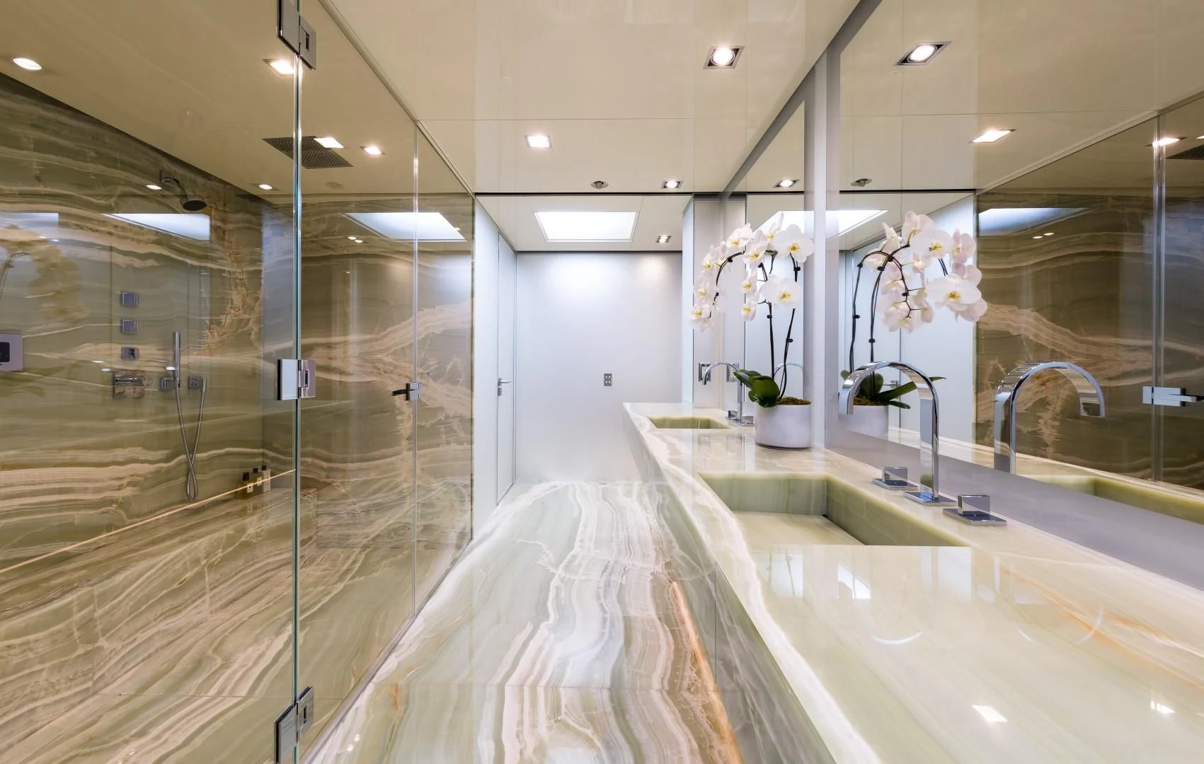 a large bathroom with a large glass shower aboard CHASSEUR Yacht for Charter