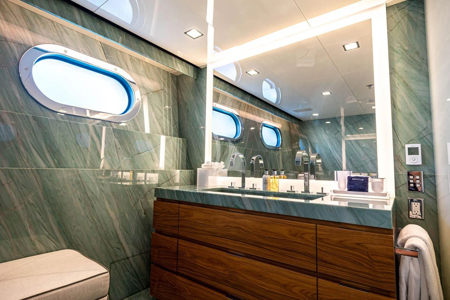 a bathroom with a large mirror aboard CHASSEUR Yacht for Charter