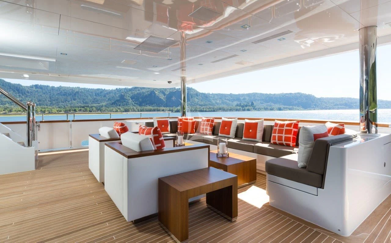 a room with a couch and a table aboard CHASSEUR Yacht for Charter
