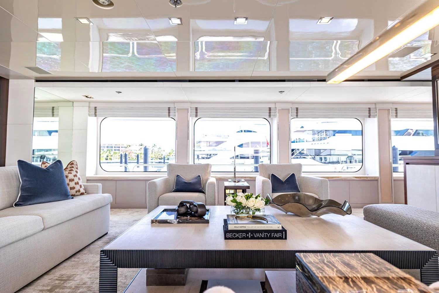 a living room with a large window aboard CHASSEUR Yacht for Charter
