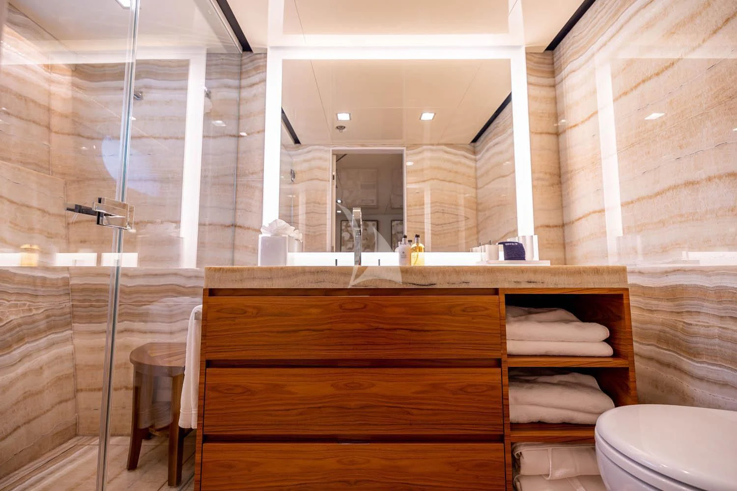 a bathroom with a glass shower aboard CHASSEUR Yacht for Charter