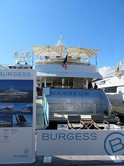 a large boat with a flag on it aboard CHASSEUR Yacht for Charter