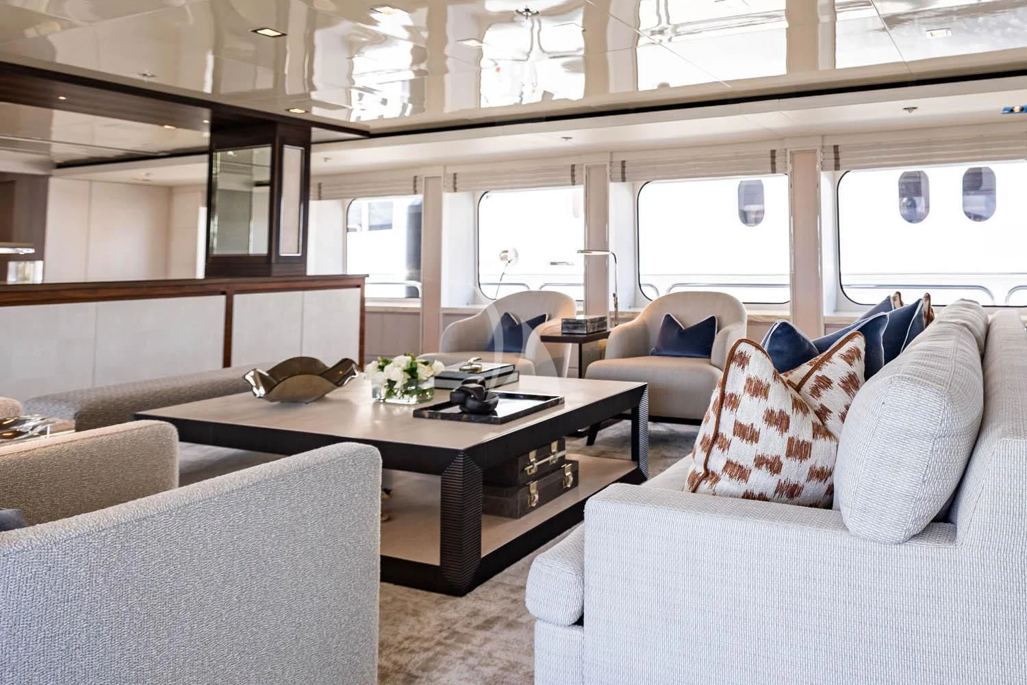 a room with couches and a table aboard CHASSEUR Yacht for Charter